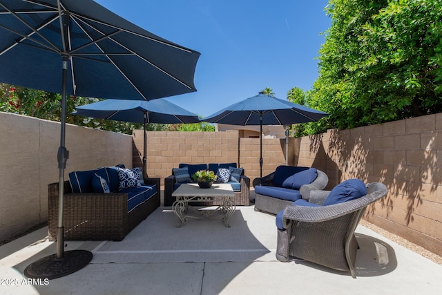 view of patio featuring fence and outdoor lounge area