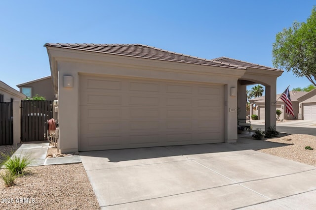 exterior space with concrete driveway