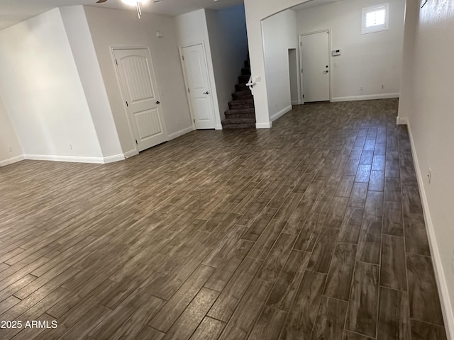 interior space with dark hardwood / wood-style floors and ceiling fan