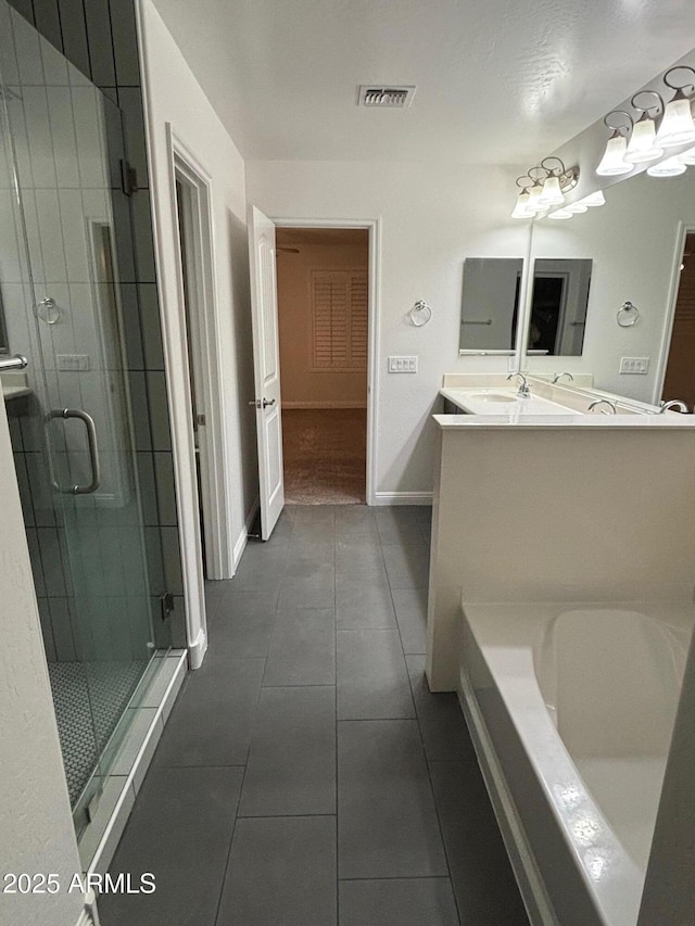 bathroom featuring vanity, tile patterned floors, and separate shower and tub