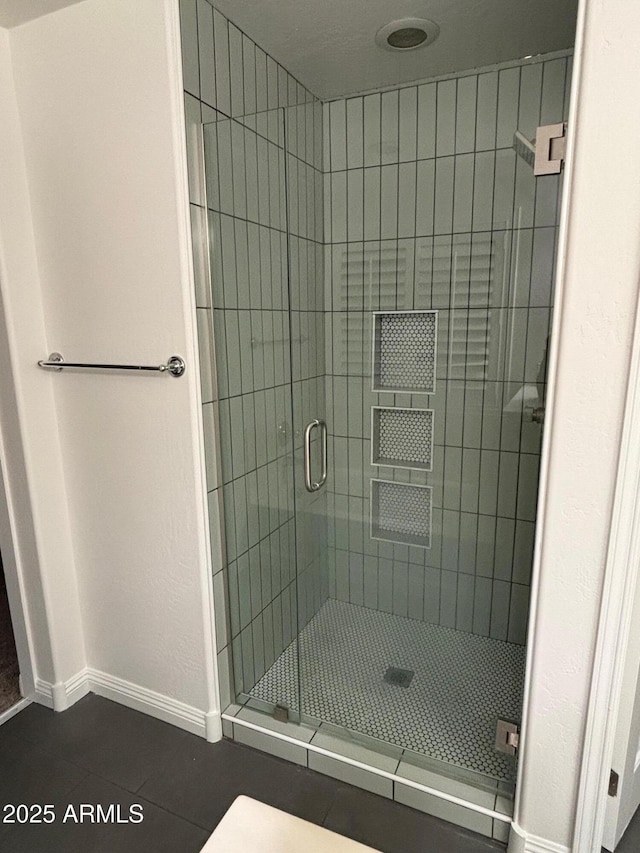 bathroom featuring tile patterned floors and walk in shower