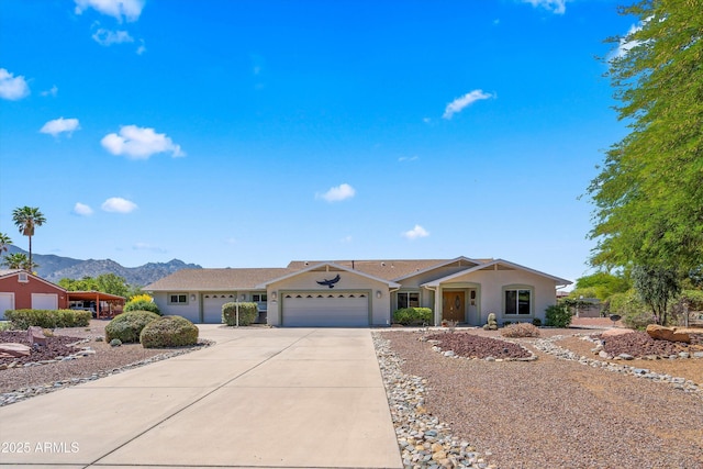 4048 E Adams Rib Pl, Tucson, AZ 85739 - single story home with a garage, a mountain view, stucco siding, and concrete driveway