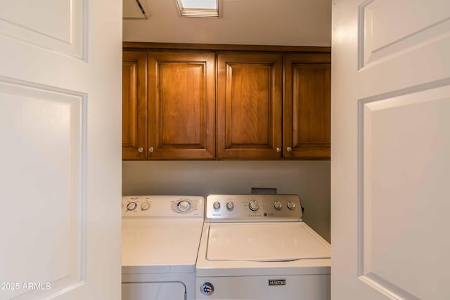 laundry area with cabinet space and washing machine and dryer