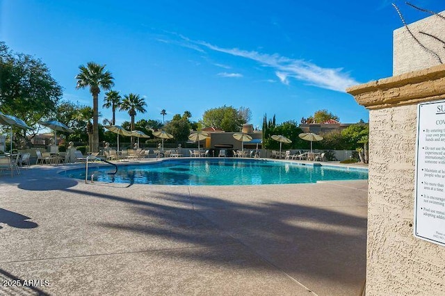 community pool with a patio