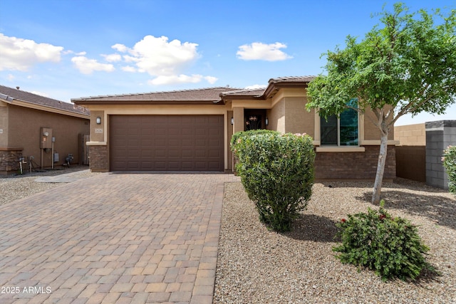 26242 N 122nd Ln, Peoria, AZ 85383 - view of front of home with a tiled roof, a garage, fence, stucco siding, and decorative driveway