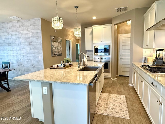 26242 N 122nd Ln, Peoria, AZ 85383 - kitchen featuring a sink, wall chimney range hood, wood tiled floor, and stainless steel appliances