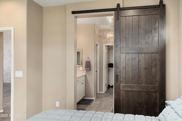 26242 N 122nd Ln, Peoria, AZ 85383 - bedroom with light wood finished floors and connected bathroom