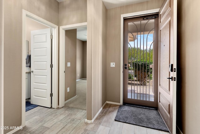 26242 N 122nd Ln, Peoria, AZ 85383 - entryway featuring light wood finished floors and baseboards