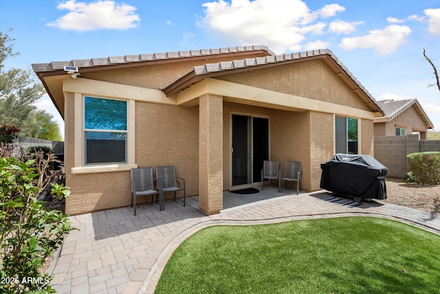 26242 N 122nd Ln, Peoria, AZ 85383 - rear view of property with a patio, stucco siding, and fence