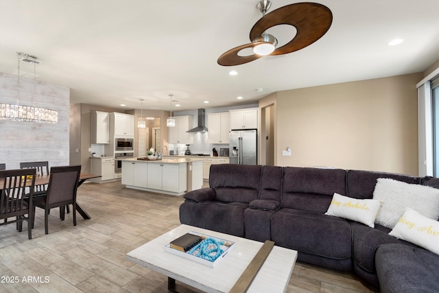 26242 N 122nd Ln, Peoria, AZ 85383 - living area featuring a ceiling fan, recessed lighting, and light wood finished floors