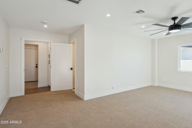 carpeted empty room with ceiling fan