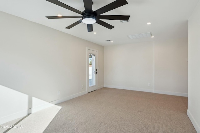 unfurnished room featuring ceiling fan and light carpet