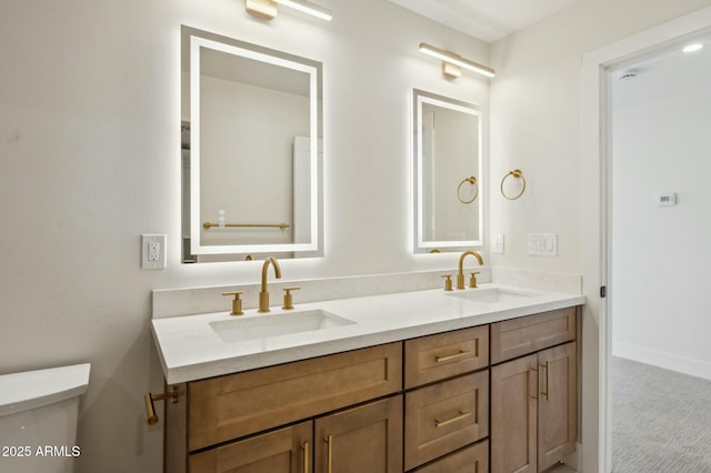 bathroom with toilet and vanity