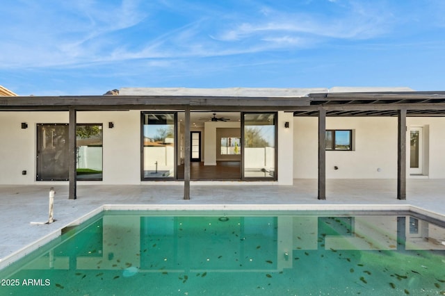 rear view of house featuring a patio and ceiling fan