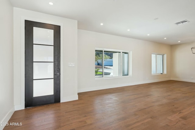 foyer entrance with dark hardwood / wood-style floors