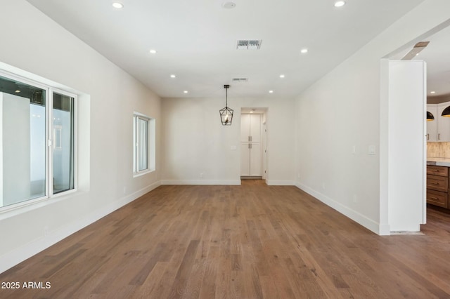 unfurnished room featuring hardwood / wood-style flooring