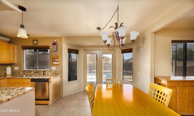 12933 W Monterey Way, Avondale, AZ 85392 - dining space featuring plenty of natural light, light tile patterned floors, and a chandelier