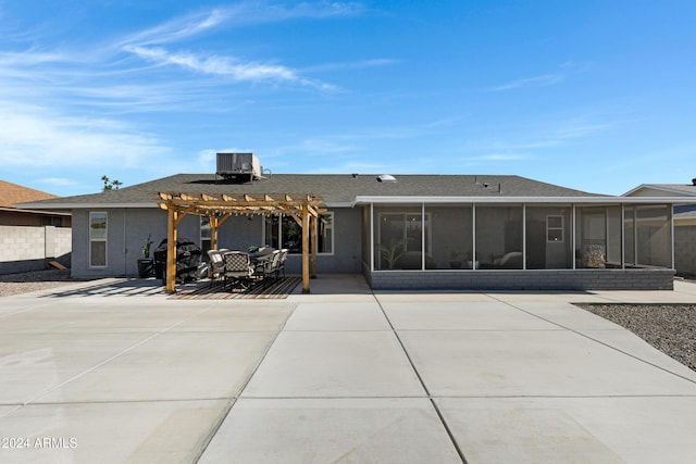 rear view of property with a patio area, central AC, a sunroom, and a pergola