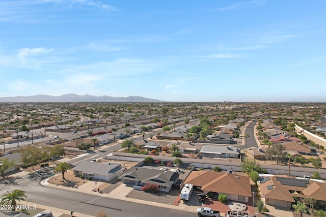 birds eye view of property featuring a mountain view