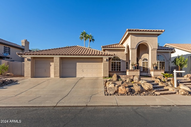 mediterranean / spanish-style house featuring a garage