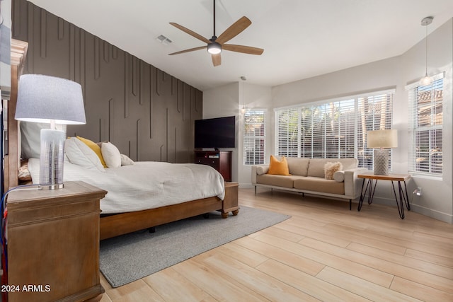 bedroom with hardwood / wood-style floors and ceiling fan