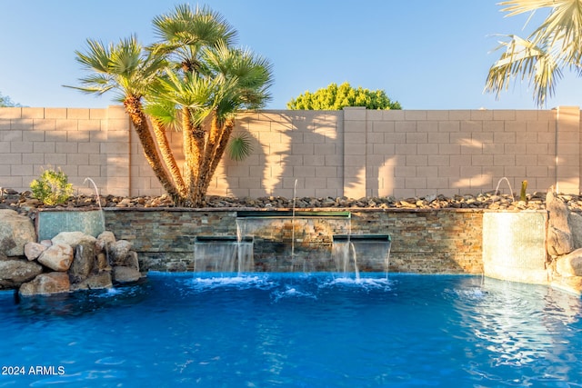 view of pool with pool water feature