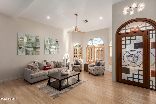 living room with light wood-type flooring and ceiling fan