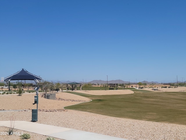 surrounding community featuring a gazebo, a yard, and a mountain view