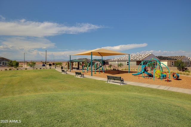 communal playground featuring a lawn