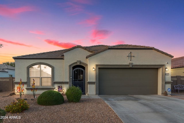 mediterranean / spanish-style home featuring a garage