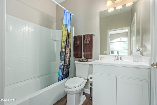 full bathroom featuring vanity, hardwood / wood-style flooring, toilet, and shower / bathtub combination with curtain