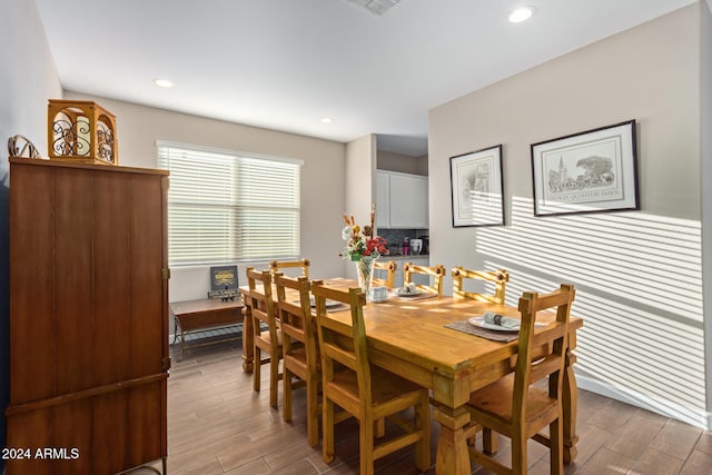 dining space with hardwood / wood-style floors