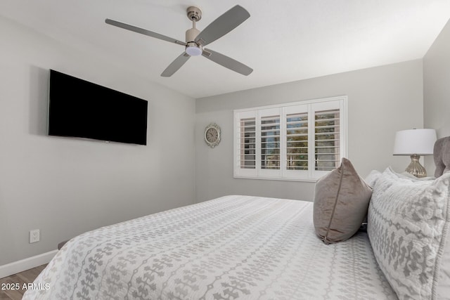 bedroom with hardwood / wood-style flooring and ceiling fan