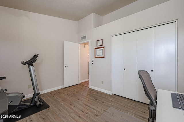 office with light hardwood / wood-style floors