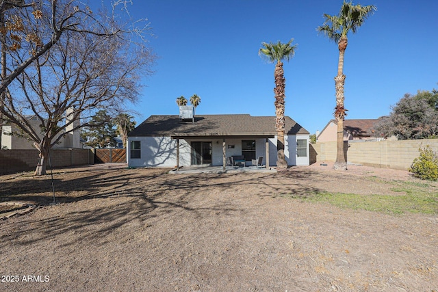 back of house with a patio area