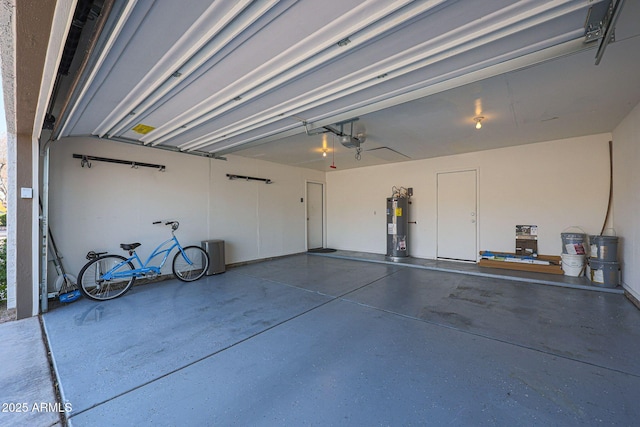 garage with water heater and a garage door opener