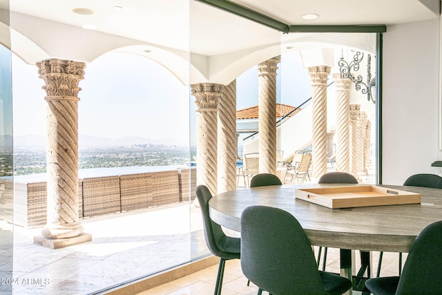 dining area with ornate columns