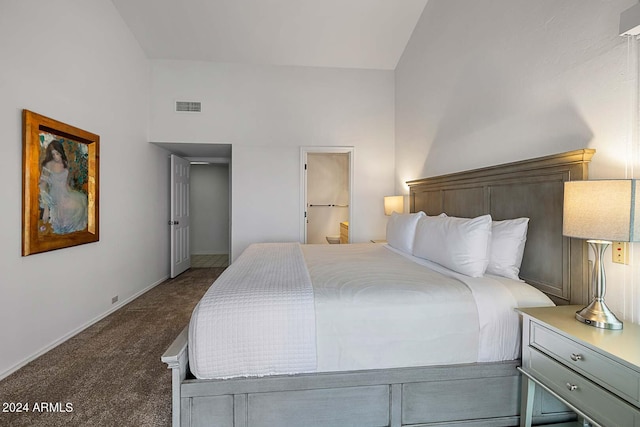 carpeted bedroom featuring high vaulted ceiling