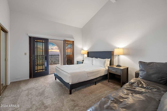 carpeted bedroom featuring high vaulted ceiling and access to exterior