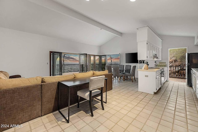 kitchen featuring light tile patterned floors, vaulted ceiling with beams, kitchen peninsula, and white cabinetry