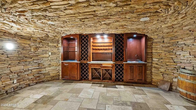 wine room featuring bar area