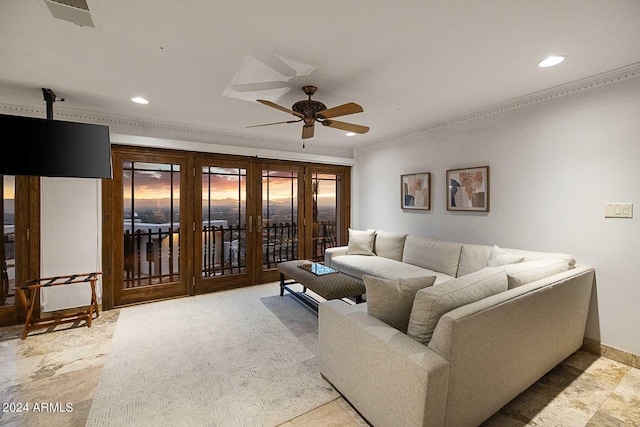 living room featuring crown molding and ceiling fan