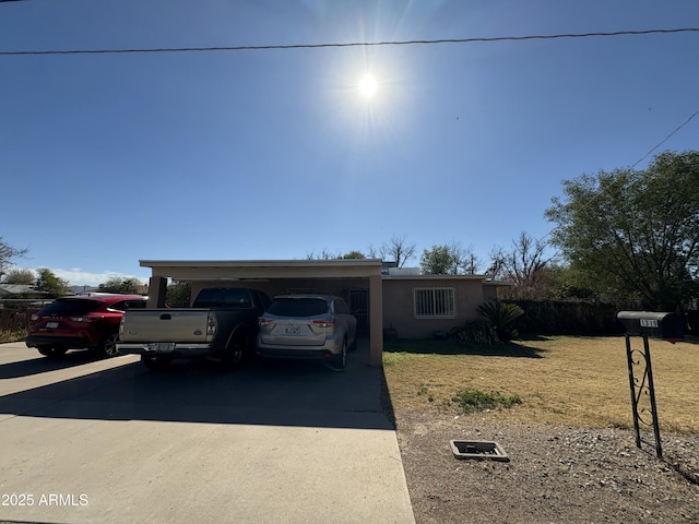 single story home featuring a carport