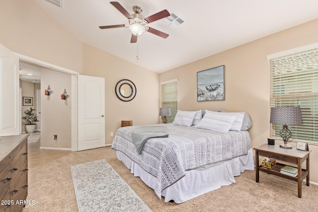 bedroom featuring lofted ceiling, light colored carpet, and ceiling fan