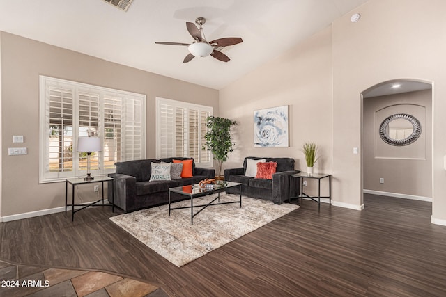 living room with ceiling fan, high vaulted ceiling, and dark hardwood / wood-style floors