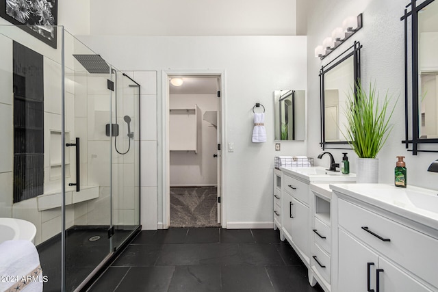 bathroom with vanity, tile patterned floors, and a shower with shower door