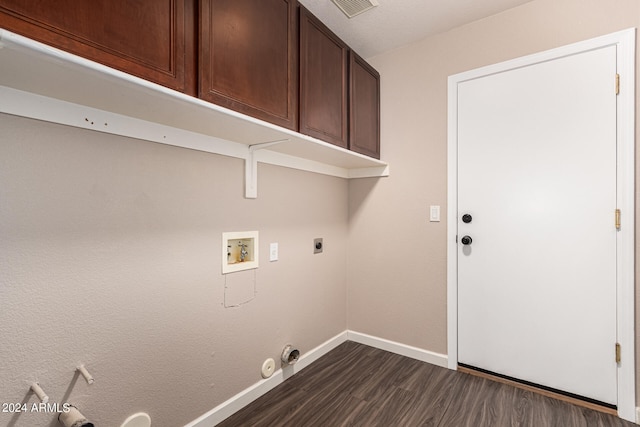 clothes washing area featuring hookup for a gas dryer, dark hardwood / wood-style flooring, electric dryer hookup, washer hookup, and cabinets