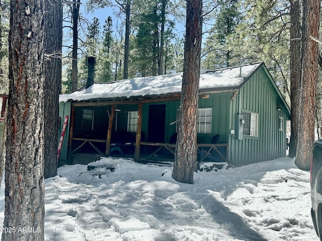 view of front of house with board and batten siding and covered porch