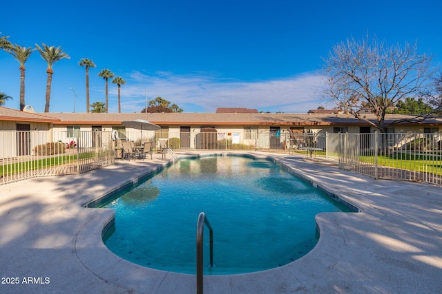 view of swimming pool with a patio