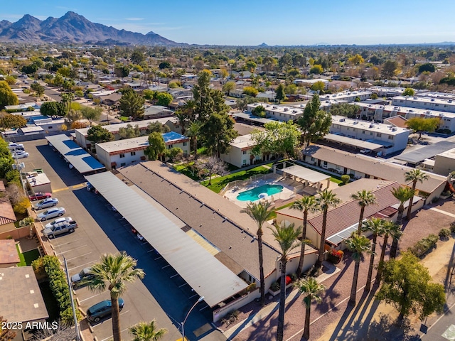 birds eye view of property with a mountain view